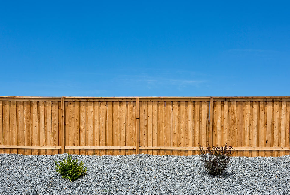 Wooden fence against clear blue sky