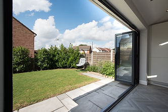 bi-fold doors and patio area of a garden