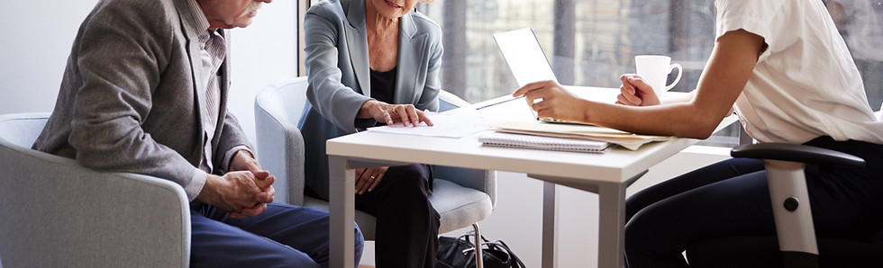 Couple Sitting with Financial Advisor