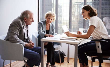 Couple Sitting with Financial Advisor