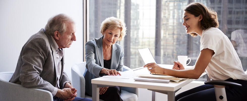 Couple Sitting with Financial Advisor