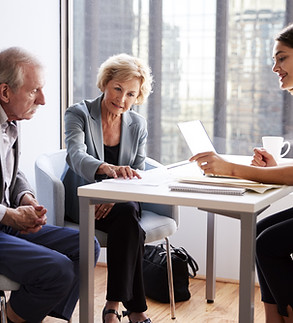 Couple Sitting with Financial Advisor