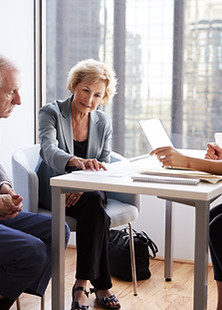 Couple Sitting with Financial Advisor