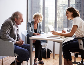 Couple Sitting with Financial Advisor