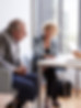 Couple Sitting with Financial Advisor