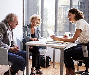 Couple Sitting with Financial Advisor