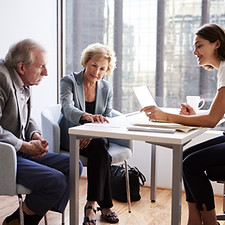 Couple Sitting with Financial Advisor