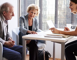 Couple Sitting with Financial Advisor