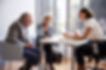 Couple Sitting with Financial Advisor