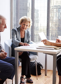 Couple Sitting with Financial Advisor