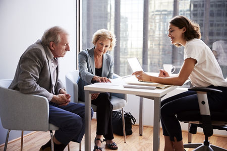 Couple Sitting with Financial Advisor