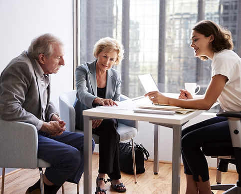 Couple Sitting with Financial Advisor