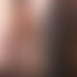 A cityscape at sunset featuring a mix of modern and historic buildings.