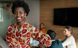 Businesswoman in front of coworkers