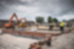 Professionals laying house foundation