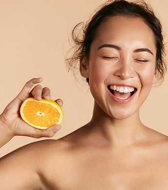 Smiling Woman with Orange