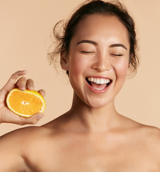 Smiling Woman with Orange