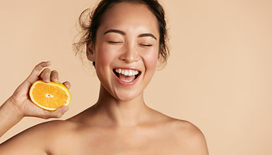 Smiling Woman with Orange