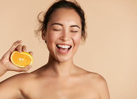 Smiling Woman with Orange