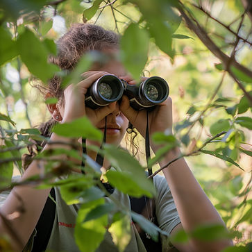 person with binoculars