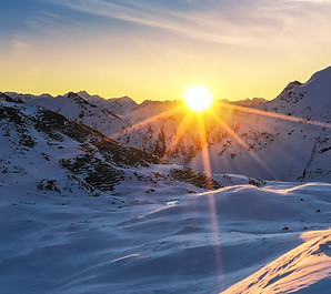 Sunshine on snowy mountains