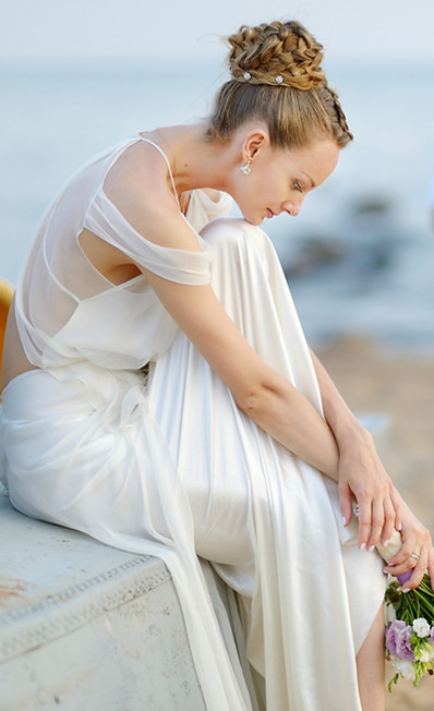 Bride on sandy beach