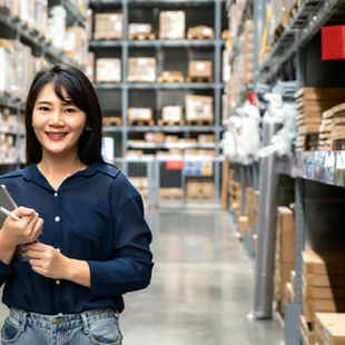 A female staff in a warehouse