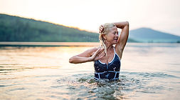 An Older Woman Bathing in. the Sea