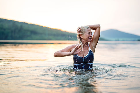 An Older Woman Bathing in. the Sea