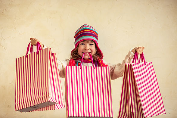 Child Holding Shopping Bags