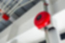 the red emergency buzzer on the wall