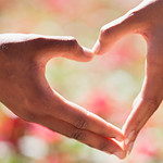 Two hands formed a heart shape to symbolise empathy and human-centred design