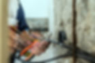 Photo of Electrician peeling off insulation from wires - closeup on hands and pliers. elec