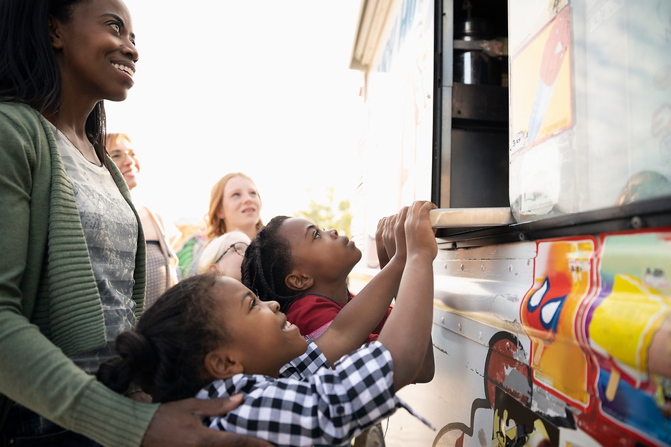 Family ordering ice cream from a food truck