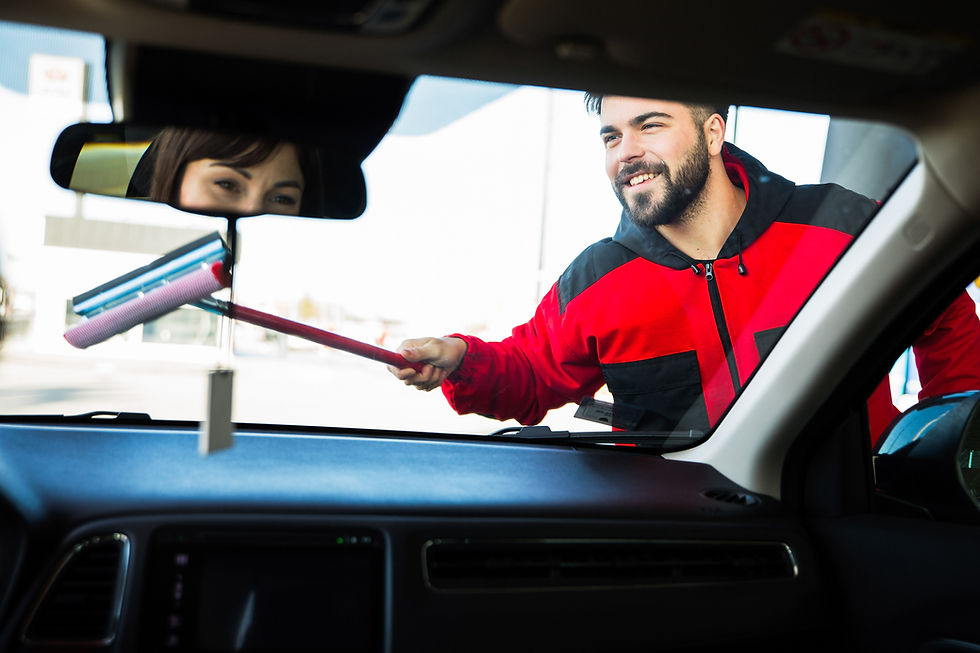 Man Cleaning Windshield
