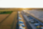 arial view of trucking distribution center against backdrop of farmland