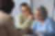 Older couple reviewing important documents with a property expert