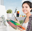 Asian artist painting on a canvas