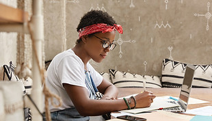 A Young Woman Writing