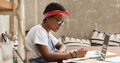 A Young Woman Writing