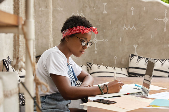A Young Woman Writing