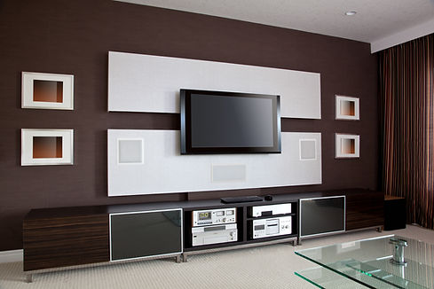 A modern home theatre with a media wall