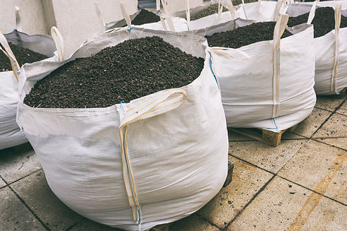 Sacks of gravel under construction site