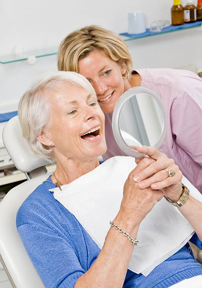 Dental assistant working on patient