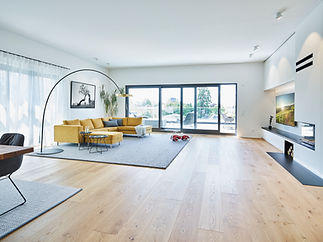 Modern living room with large windows and bright light