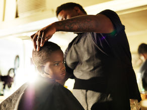 Young Black Introvert in the Barbershop