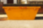 Old yellow builders skip