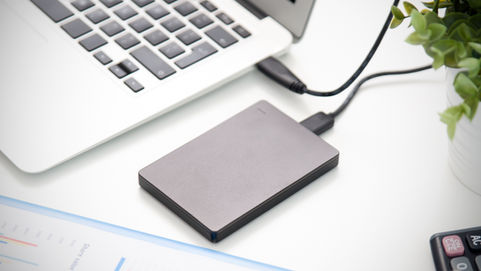 A external hard drive connected to a laptop