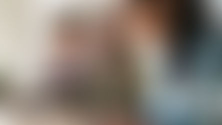 Individual smiling with two other coworkers