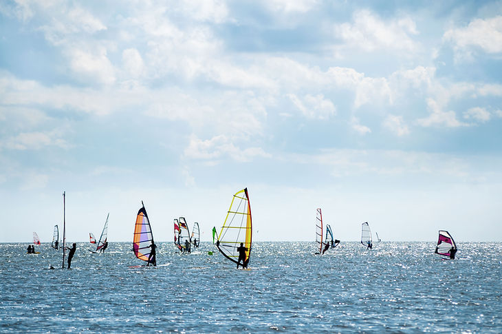 Windsurfers at the Horizon